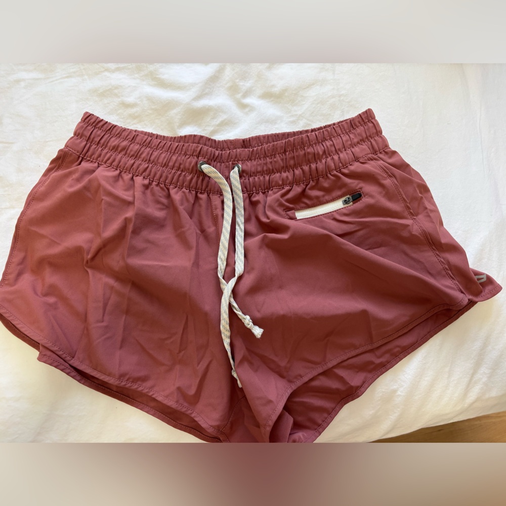 Vuori Women's Clementine Athletic Shorts in Pink / Red / Clay color